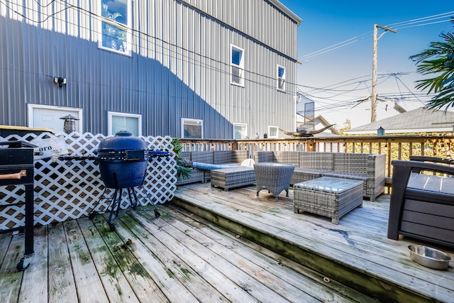 wooden terrace with an outdoor hangout area