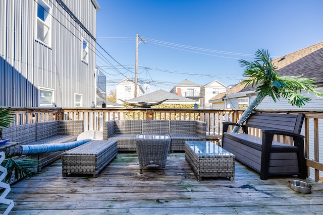 wooden deck with outdoor lounge area