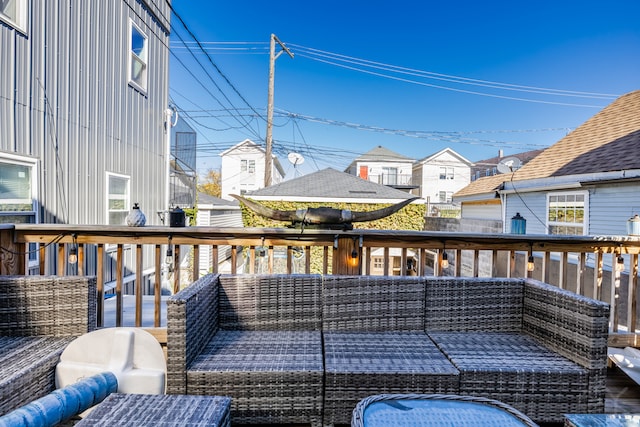 wooden terrace with a gazebo and outdoor lounge area