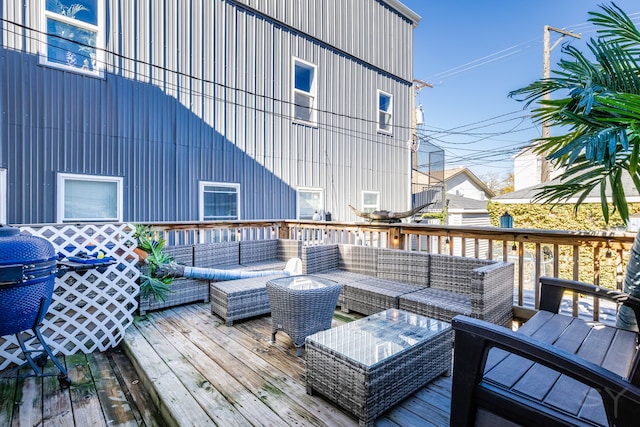 wooden deck with an outdoor hangout area