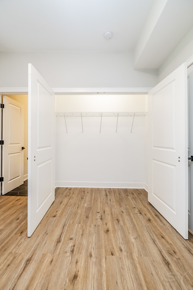 walk in closet featuring light wood-type flooring