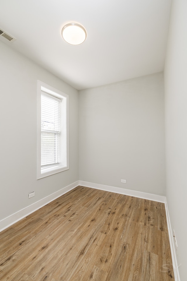 unfurnished room featuring light hardwood / wood-style flooring