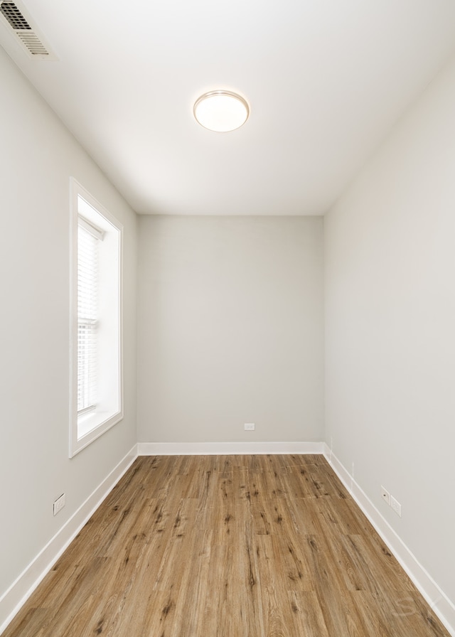 unfurnished room with light hardwood / wood-style floors