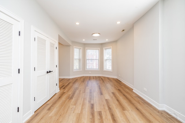 unfurnished room with light hardwood / wood-style floors