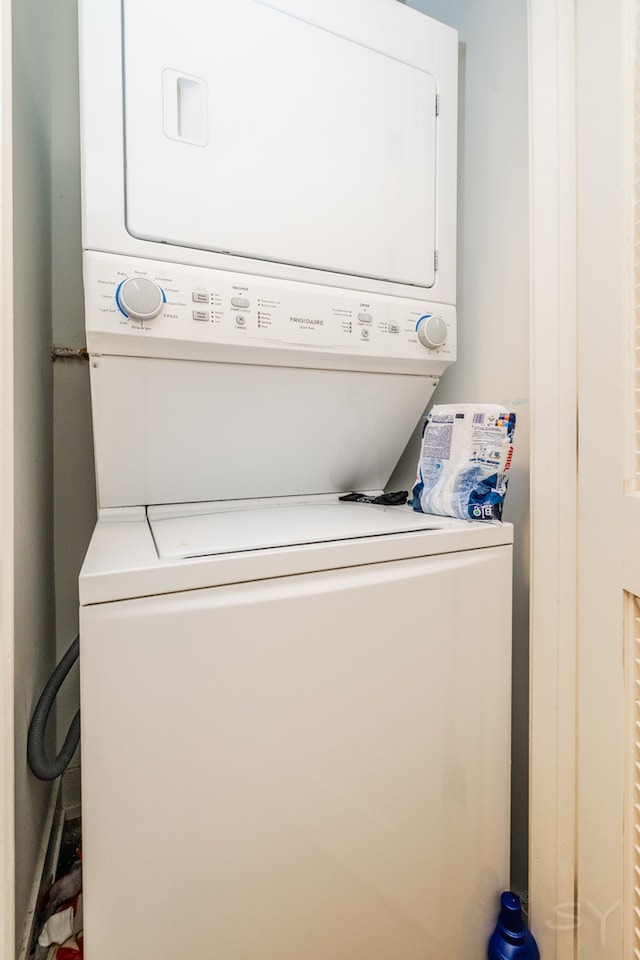 laundry room with stacked washer and clothes dryer