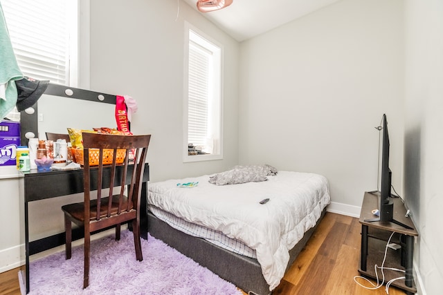 bedroom with hardwood / wood-style floors