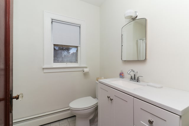 bathroom with vanity, a baseboard heating unit, toilet, and tile patterned floors