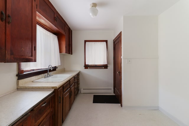 interior space with vanity and a baseboard radiator