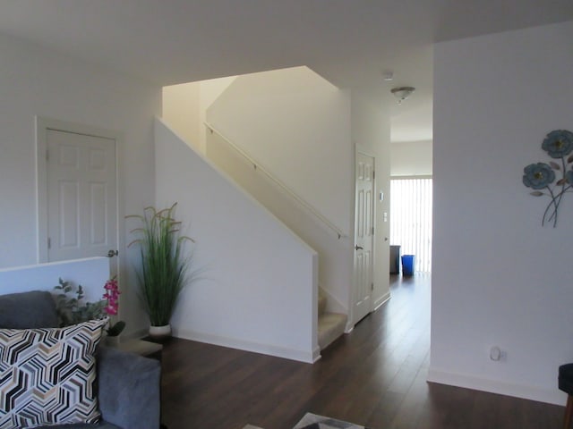 hall with dark wood-type flooring