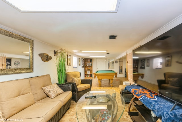 living room featuring crown molding and billiards