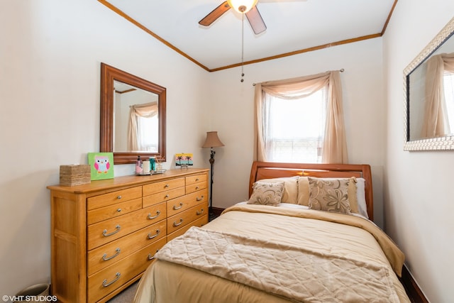 bedroom with ceiling fan, crown molding, and multiple windows