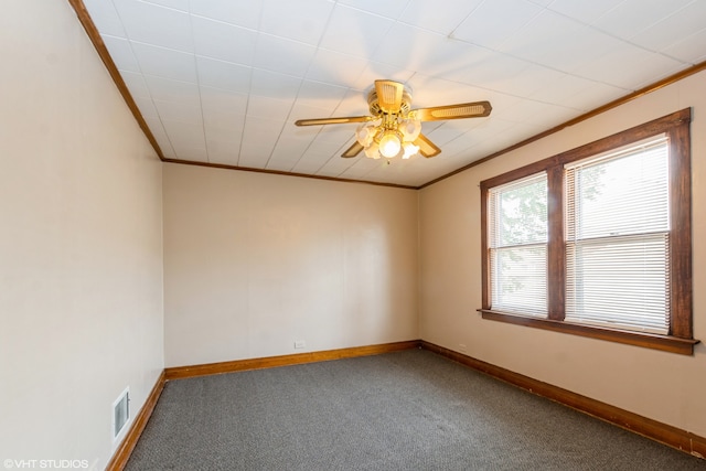 unfurnished room featuring crown molding, carpet, and ceiling fan