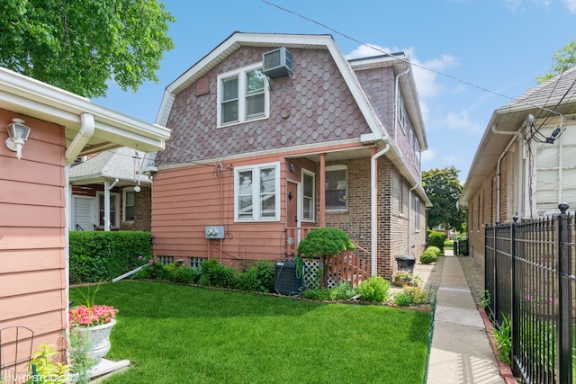 bungalow-style home with a front lawn and an AC wall unit