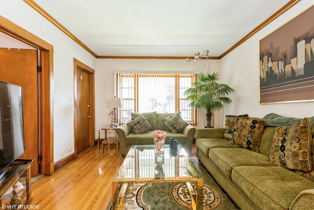 living room featuring ornamental molding and light hardwood / wood-style floors