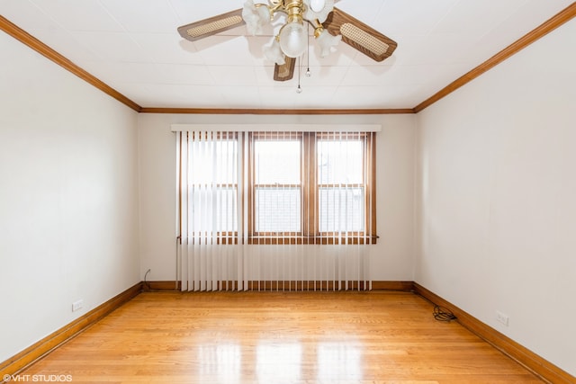 empty room featuring crown molding, light wood-type flooring, and ceiling fan