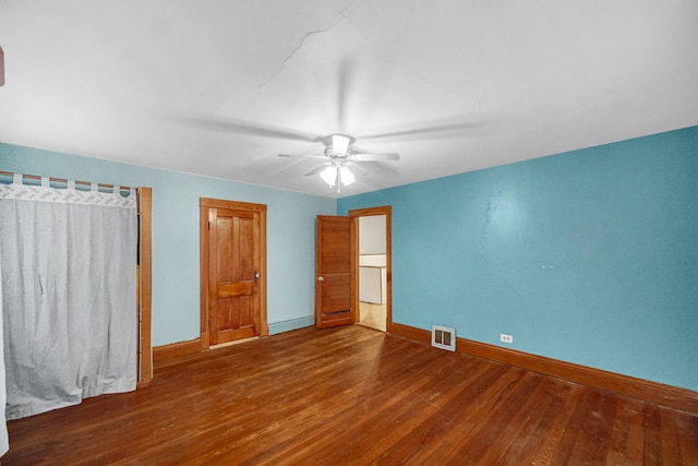 unfurnished bedroom with hardwood / wood-style floors and ceiling fan