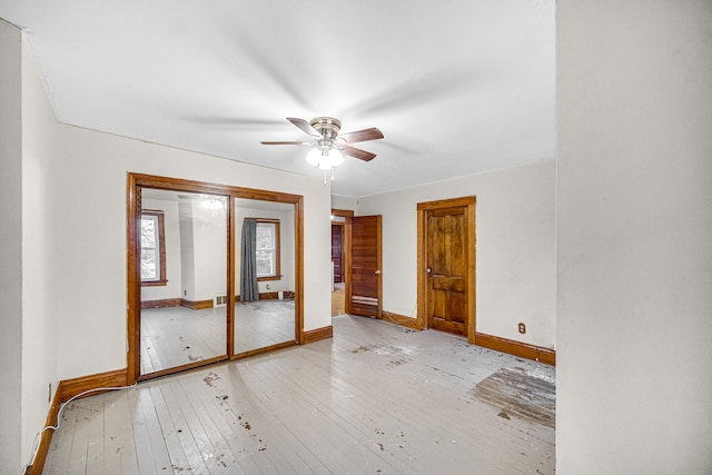 unfurnished room with ceiling fan and light hardwood / wood-style floors