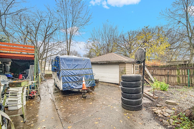 view of patio / terrace with an outbuilding and a garage