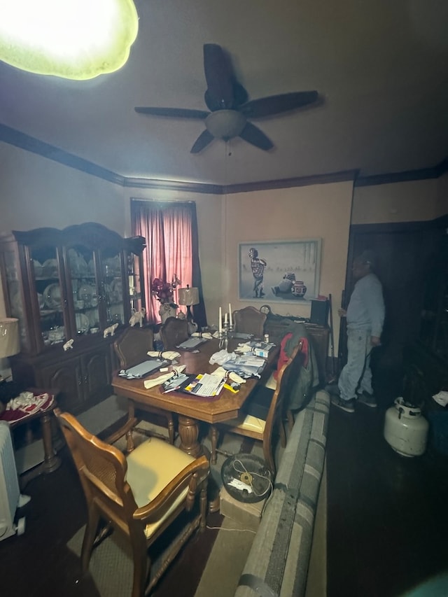 dining area featuring ornamental molding and ceiling fan