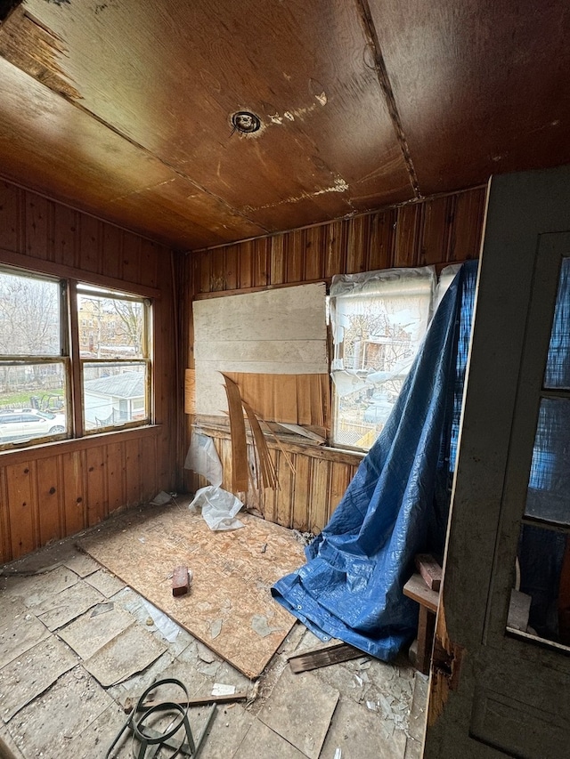 misc room featuring wood walls