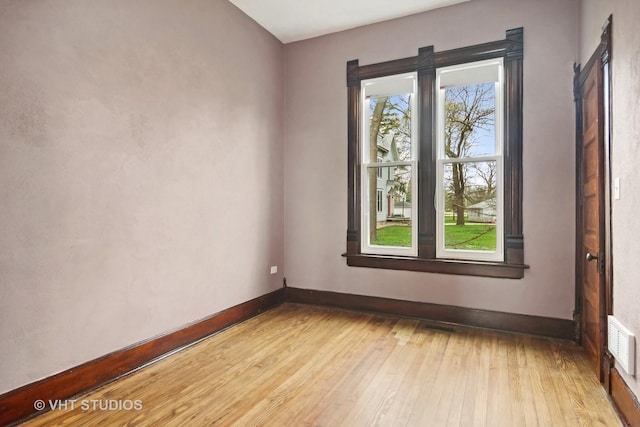 unfurnished room featuring light hardwood / wood-style floors