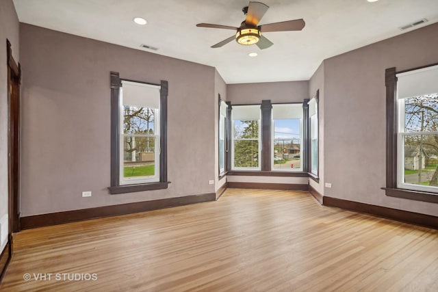 unfurnished room featuring ceiling fan and light wood-type flooring