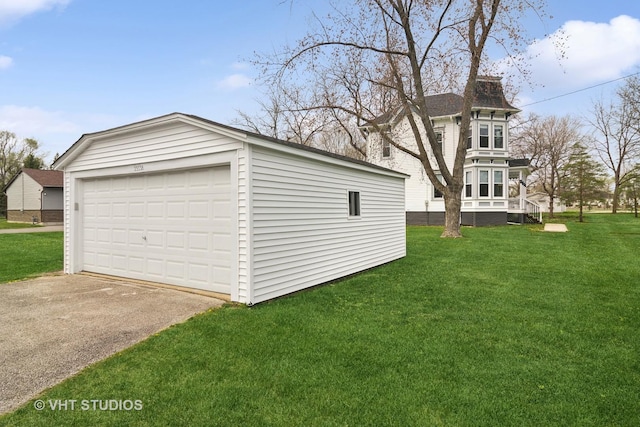 garage with a lawn