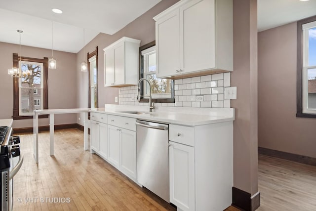 kitchen featuring plenty of natural light, sink, and stainless steel appliances