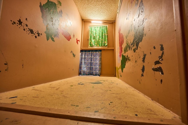 spare room featuring a textured ceiling