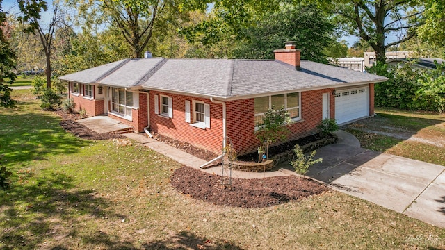 single story home featuring a garage and a front yard