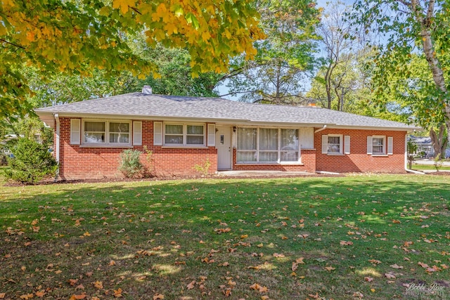 ranch-style house with a front lawn