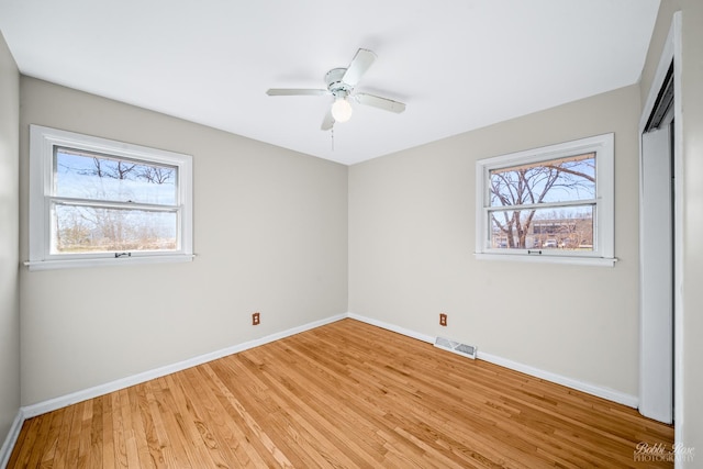 unfurnished room featuring light hardwood / wood-style floors and ceiling fan