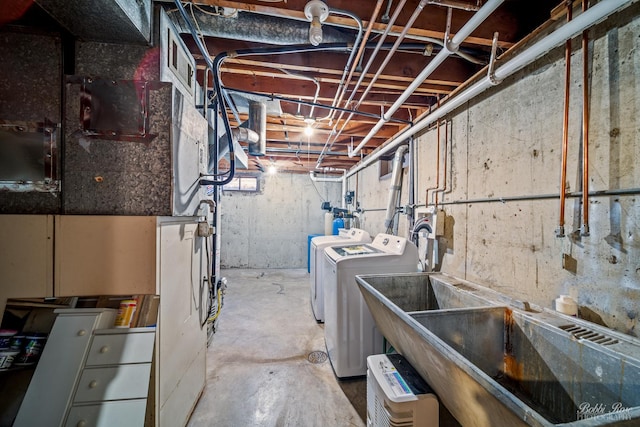 basement with independent washer and dryer and sink