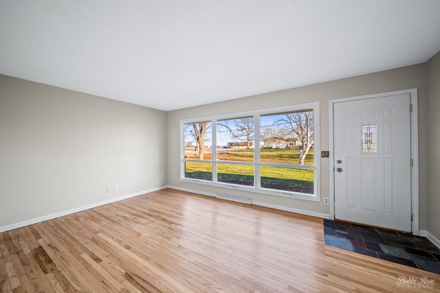 foyer entrance with light wood-type flooring