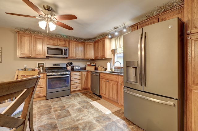 kitchen with sink, stainless steel appliances, and ceiling fan