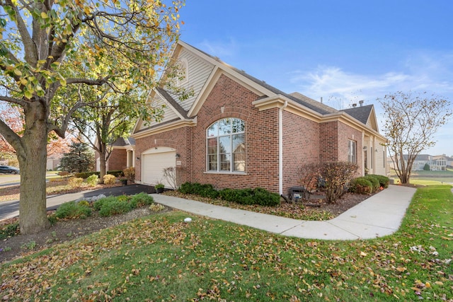 view of property exterior with a garage and a lawn