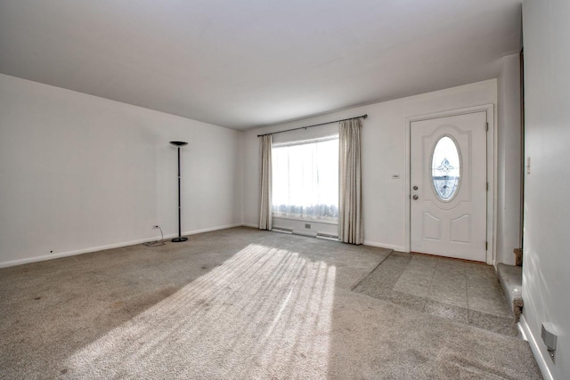 entryway featuring a wealth of natural light and light carpet