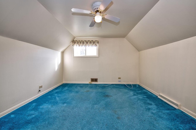 additional living space with carpet flooring, ceiling fan, and lofted ceiling