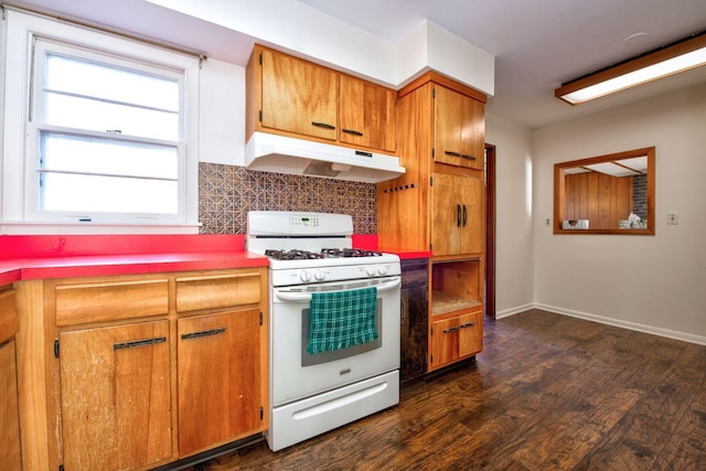 kitchen featuring backsplash, white range with gas cooktop, and dark wood-type flooring