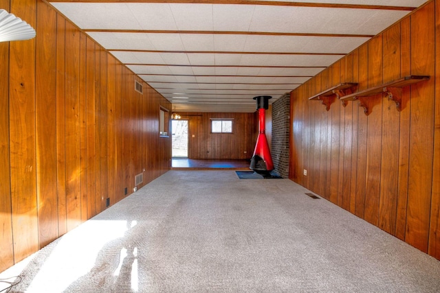 interior space with wood walls and carpet