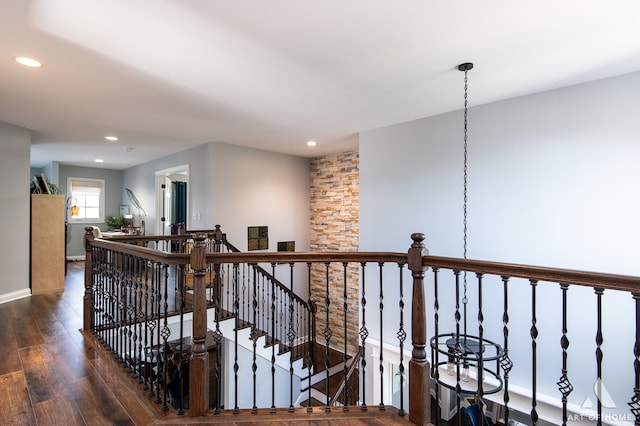 corridor featuring dark hardwood / wood-style floors