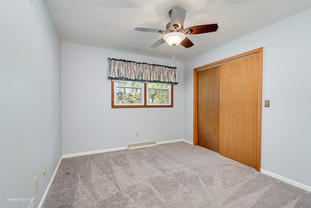 unfurnished bedroom featuring carpet flooring, a closet, and ceiling fan