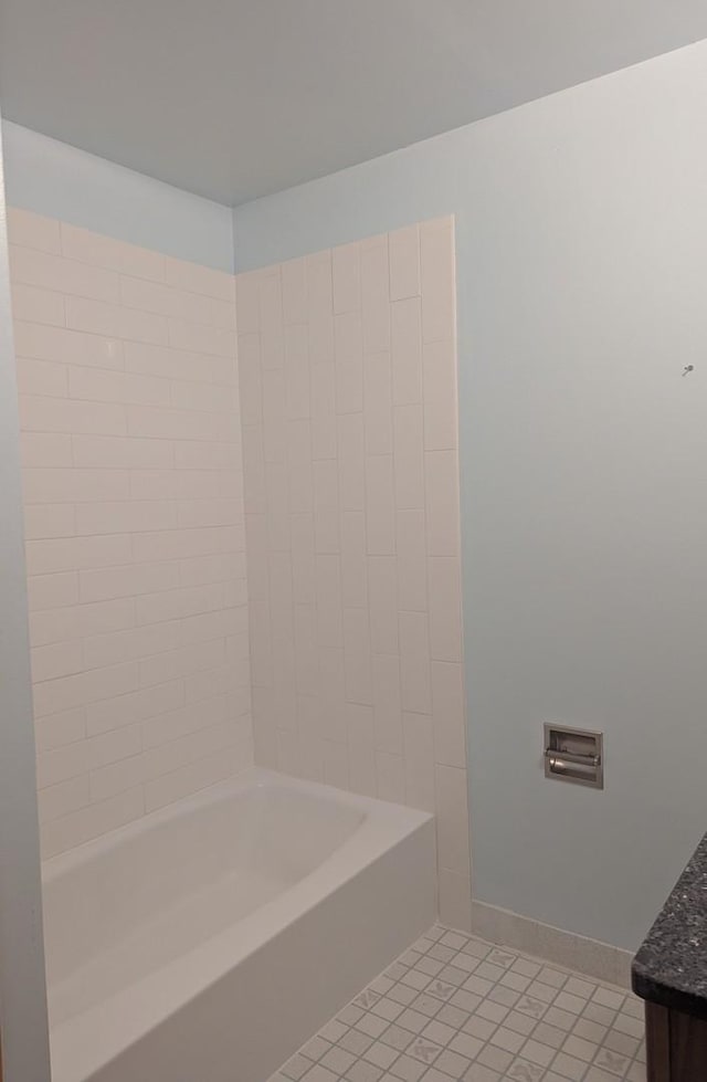 full bath featuring tile patterned flooring, vanity, baseboards, and shower / bathtub combination