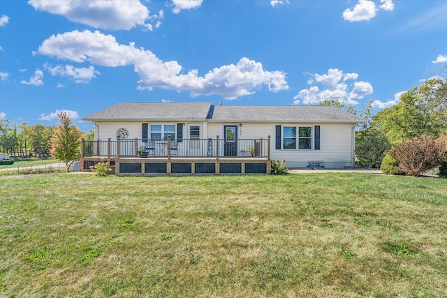 single story home featuring a wooden deck and a front lawn