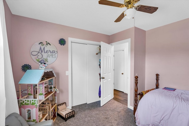 carpeted bedroom featuring a closet and ceiling fan