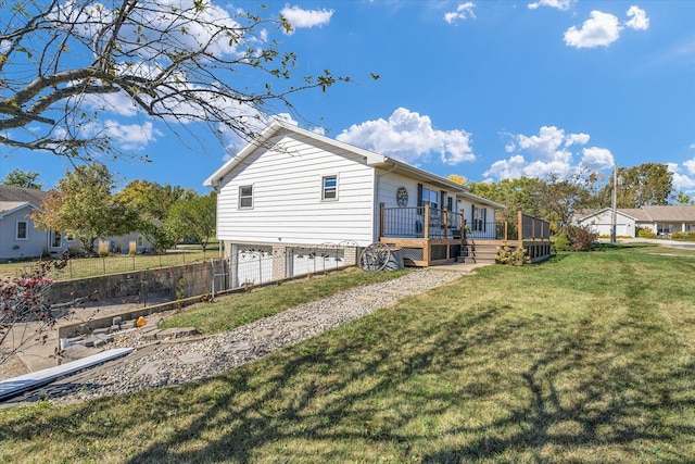 view of property exterior featuring a wooden deck and a yard