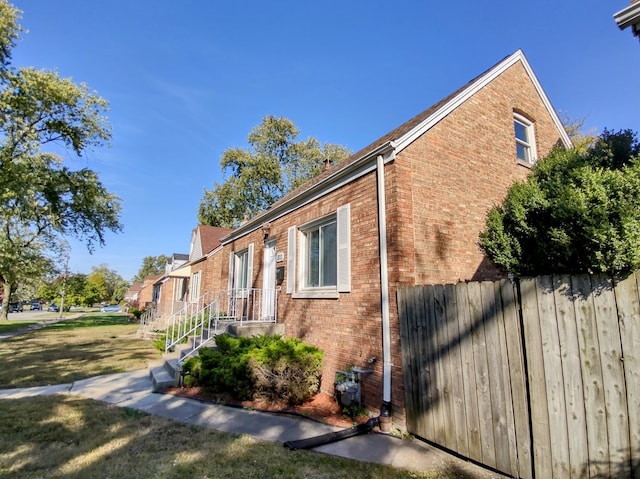 view of home's exterior featuring a yard