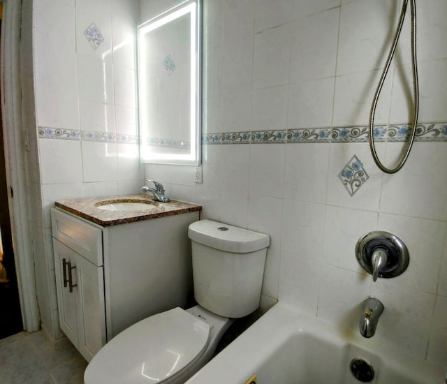 full bathroom with vanity, shower / tub combination, tile walls, tile patterned flooring, and toilet