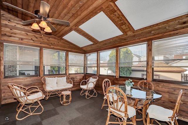 sunroom / solarium featuring a ceiling fan and vaulted ceiling