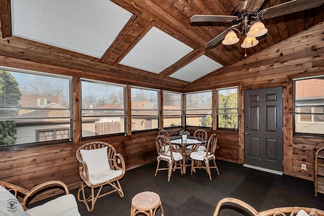 sunroom with wooden ceiling, a ceiling fan, and vaulted ceiling